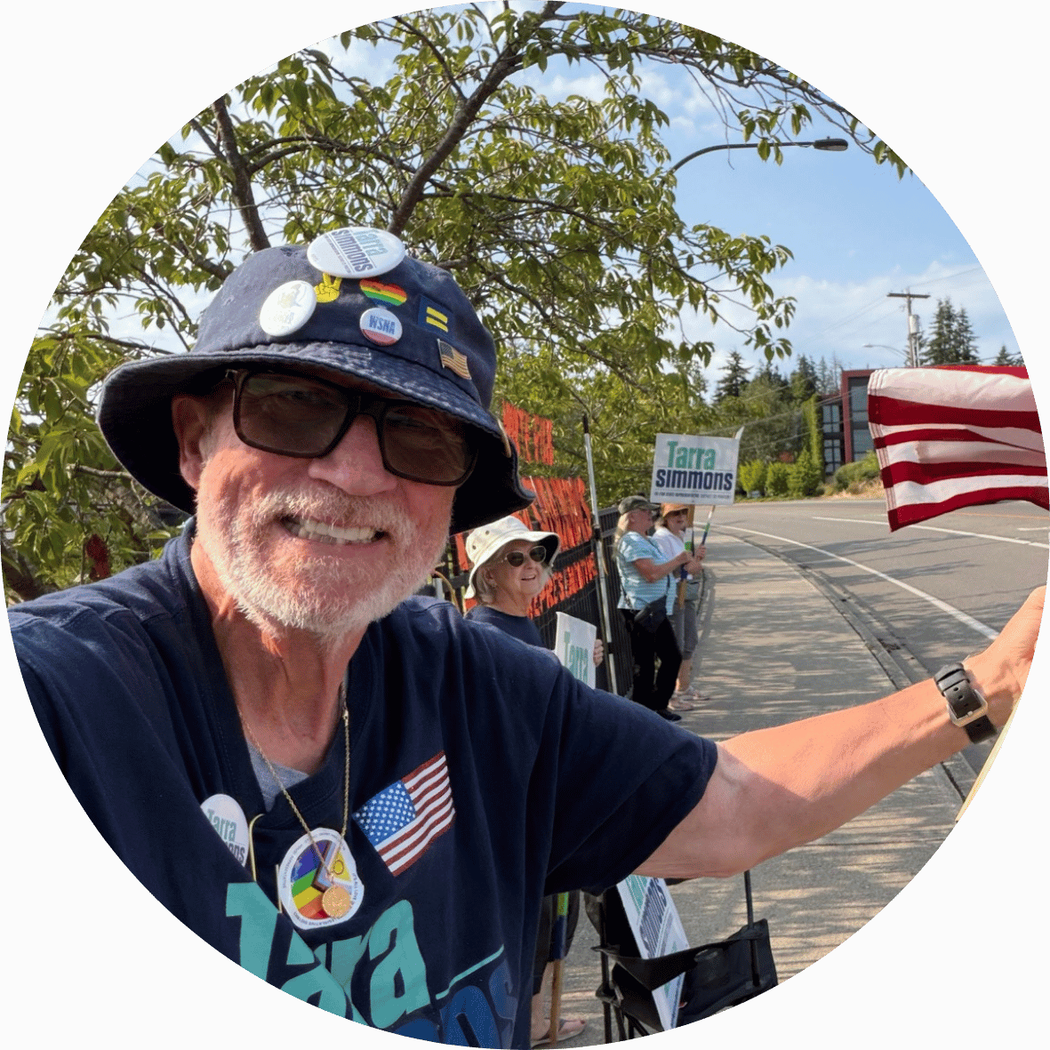 Team Tarra supporter waving an American flag in Bainbridge