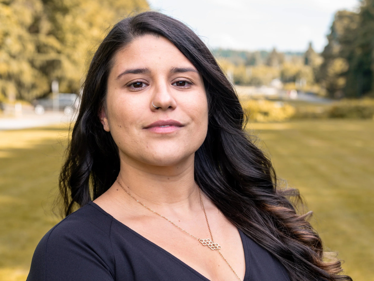 Micaela, a supporter, with UW campus in the background