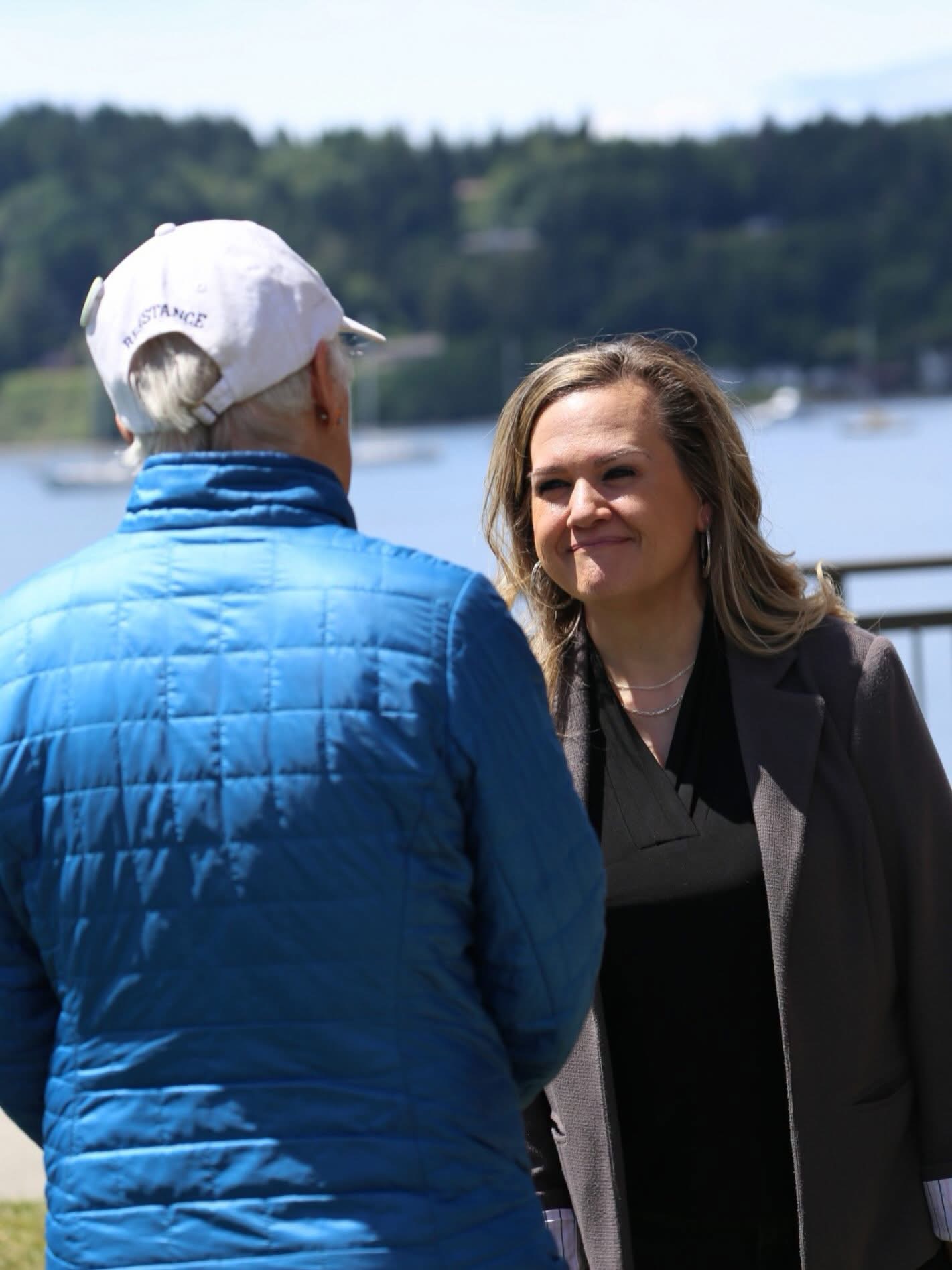 Tarra speaking with a constituent by the waterfront